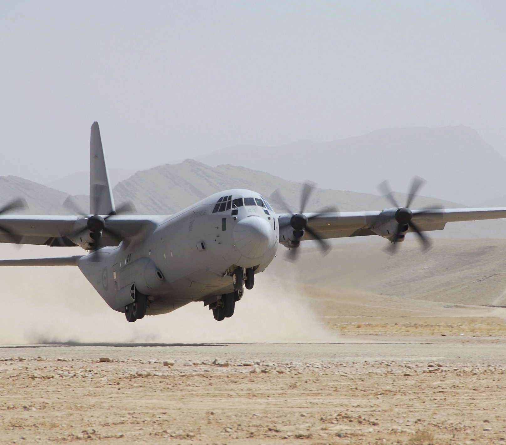 RAAF C-130J Hercules on an unsealed desert airstrip during Operation Slipper - AMCE flight-proven aircraft modifications