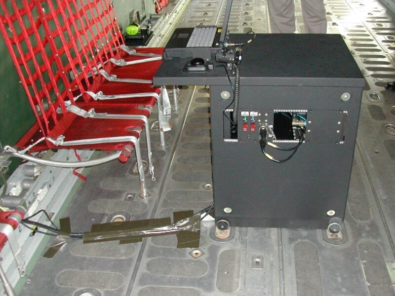 AMCE-developed equipment unit installed on the cargo floor of a C-130